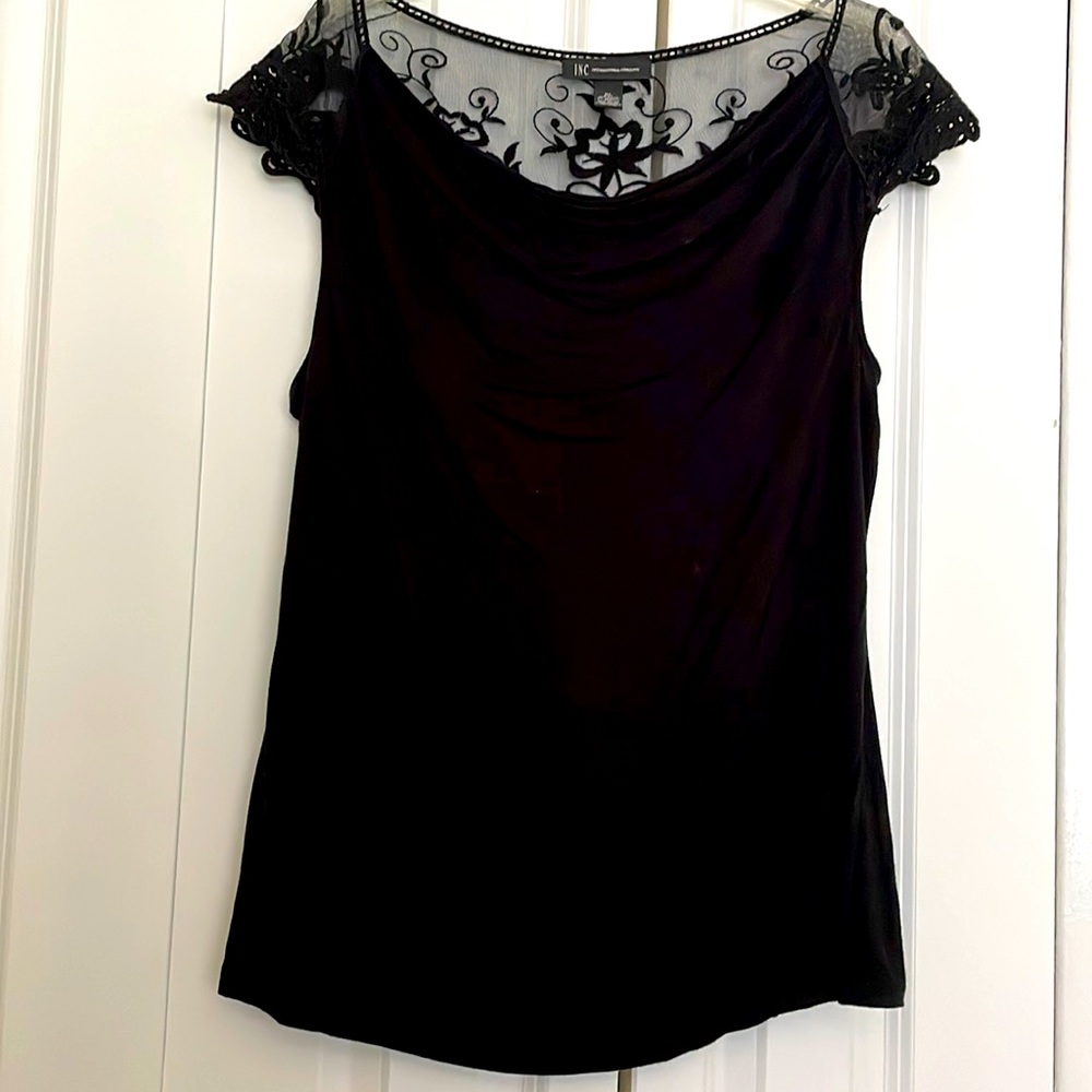 INC ladies black scoop neck top with sheer sleeves lace back. Size XL